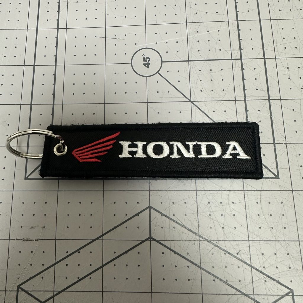 Custom embroidered woven keychain tag with split ring