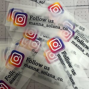 Custom DTF stickers cut from the sheet, printed on clear film